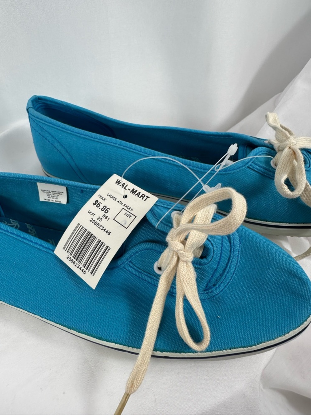Nice dark aqua color slip on Tenny size 9